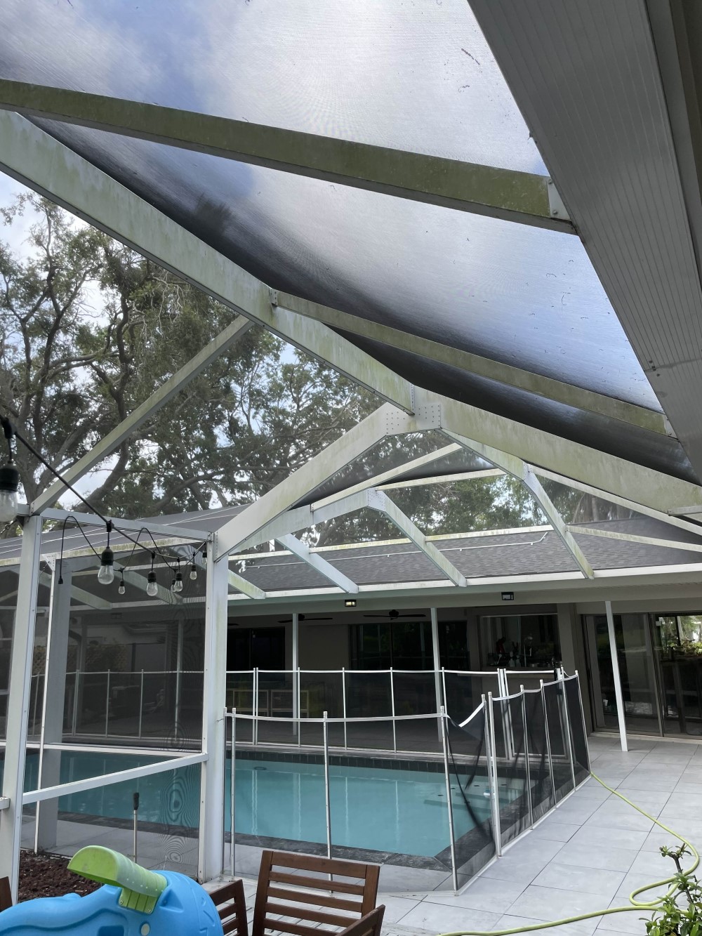 Soft Washing Pool Lanai in Tampa, FL — Safely Removing Green Grime & Restoring White Screen Frames